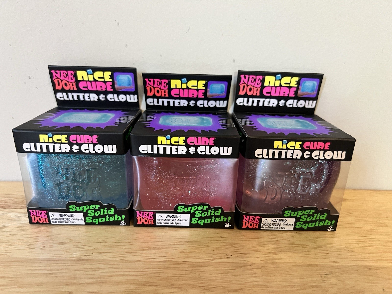 Nee Doh Nice Cube Squeeze Ball Stress Reliever, Glitter Glow, 3 Pack, Blue Pink