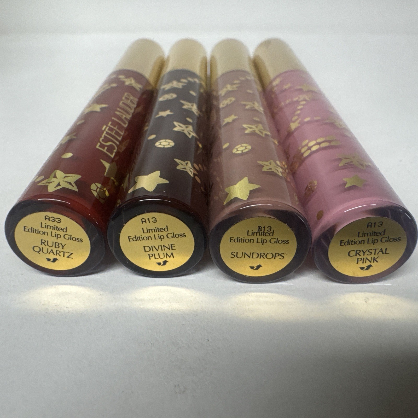 ESTEE LAUDER LIP GLOSS SET of 4 FULL SIZE ruby quartz divine plum sundrops new