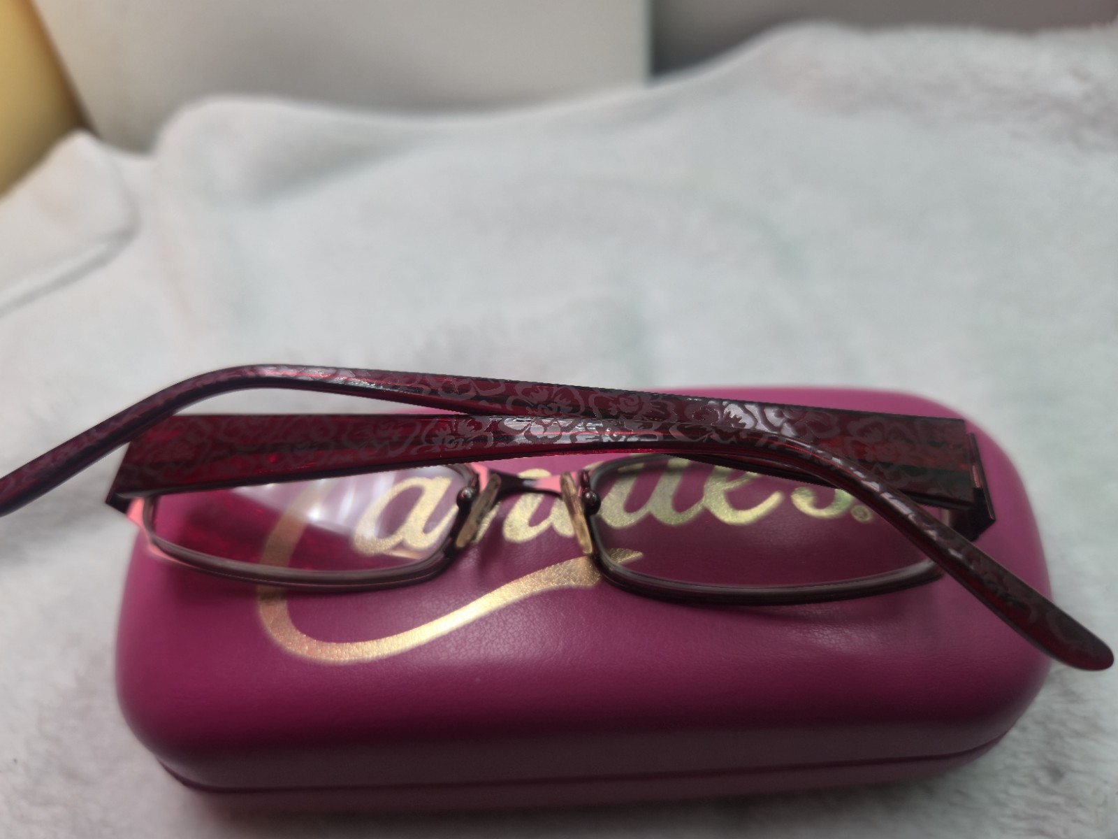 Candie’s branded Elisa burgundy plastic eyeglass frames with a matching hard…