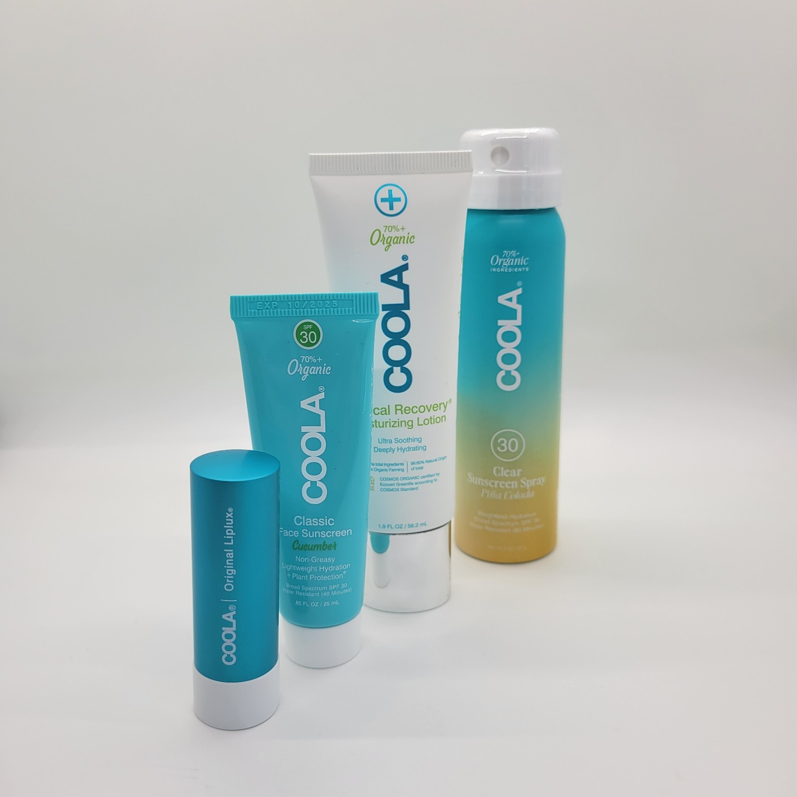 New COOLA Organic Suncare Travel Set 4 Pc Sunscreen Lip Balm Bag NWT Exp 10/2025
