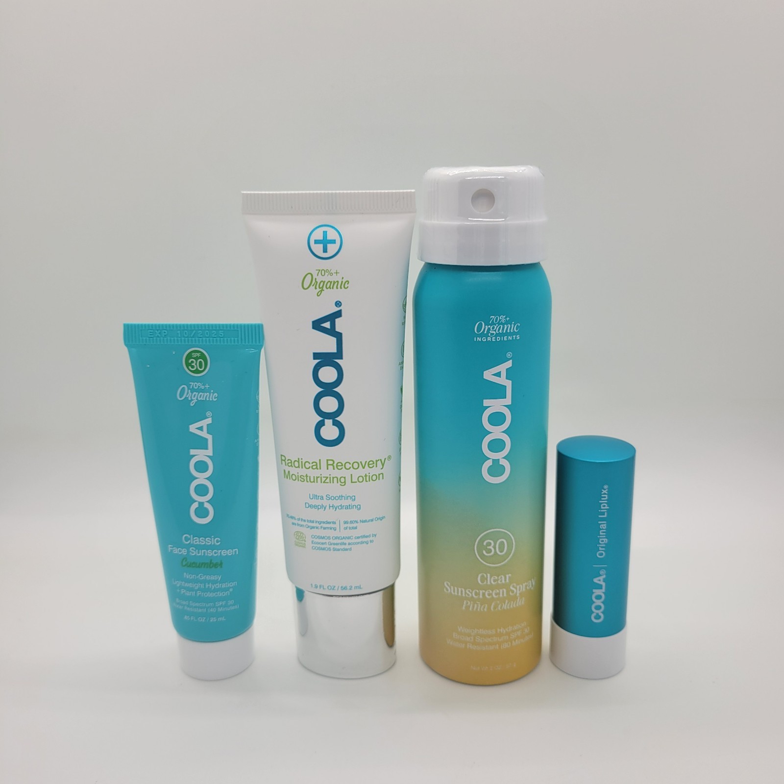 New COOLA Organic Suncare Travel Set 4 Pc Sunscreen Lip Balm Bag NWT Exp 10/2025