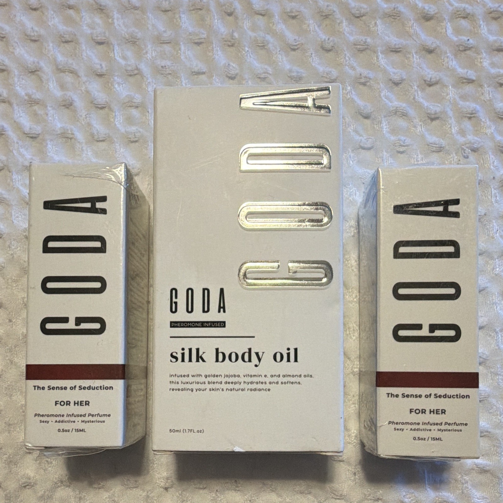 GODA Sense of Seduction pheromone perfume (2) and pheromone silk body oil (1)